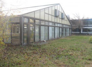 at risk for vandalism, glass enclosed pool area before board up