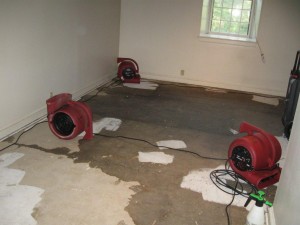 Burst water heater needs water damage restoration